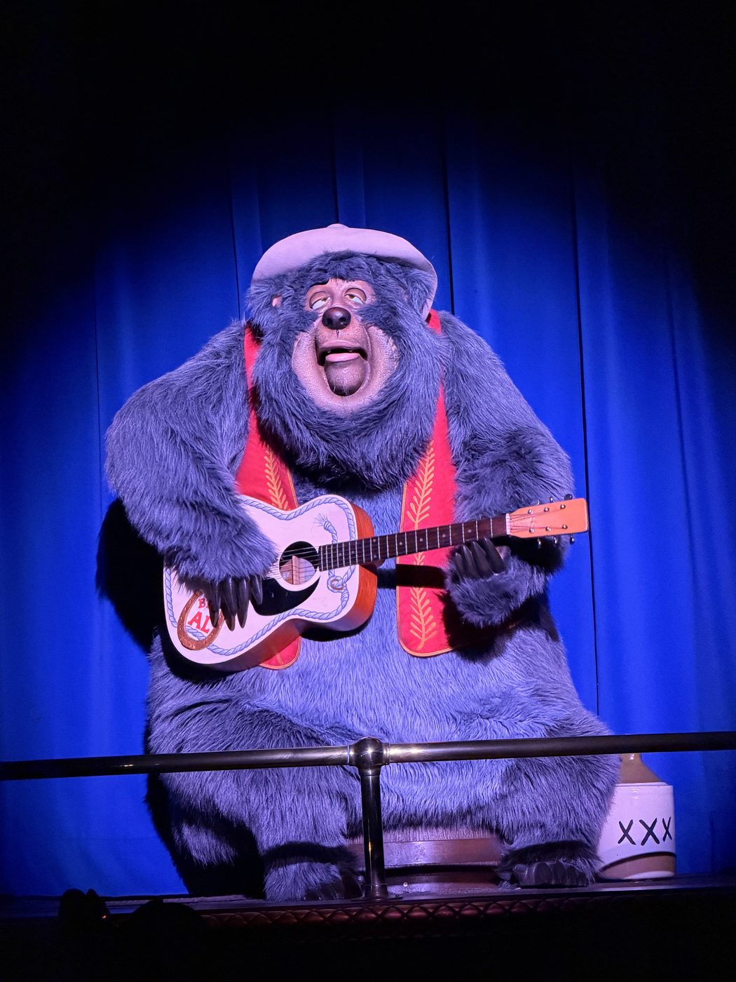 A Country Bear picks a tune
