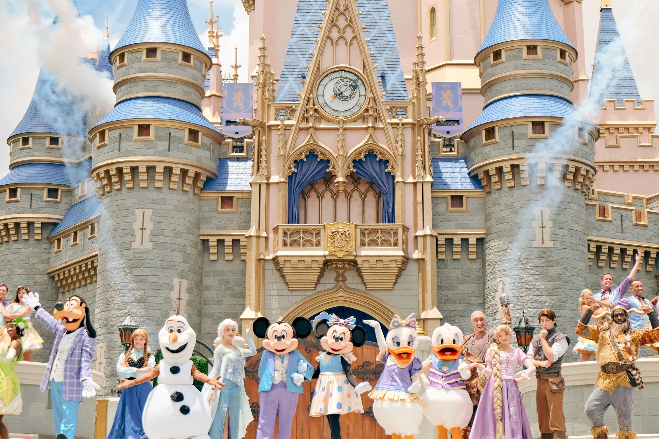 Cinderella Castle at Magic Kingdom with Mickey, Minnie, and friends on the castle stage