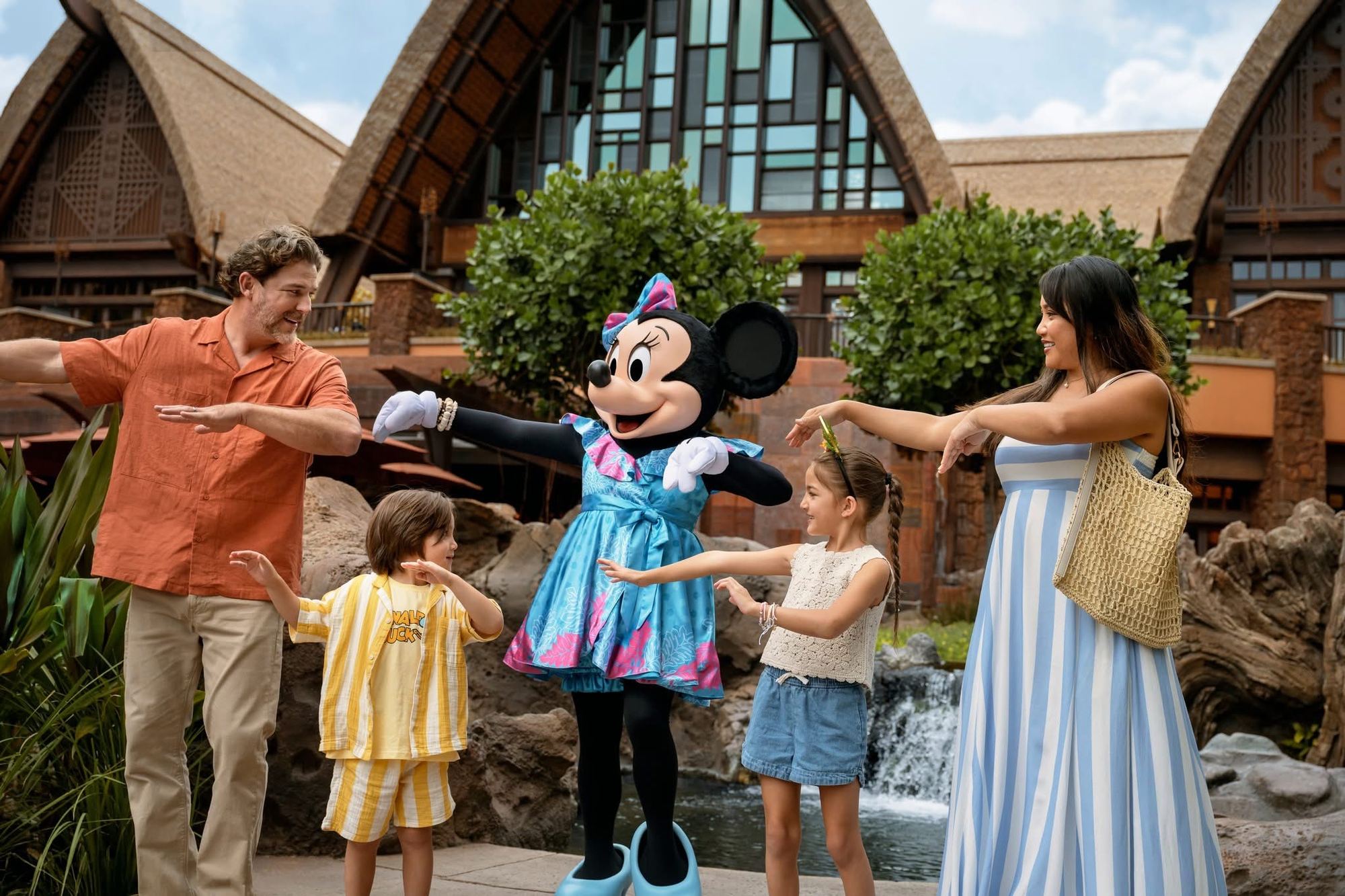 A family hula lesson with Minnie outside the Aulani lobby